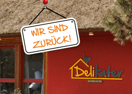 Im Hintergrund ist das Bistro Delikater zu sehen. Vorn hängt ein Schild mit der Aufschrift "Wir sind zurück".